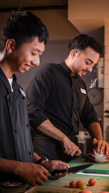 Two chefs working in the kitchen 